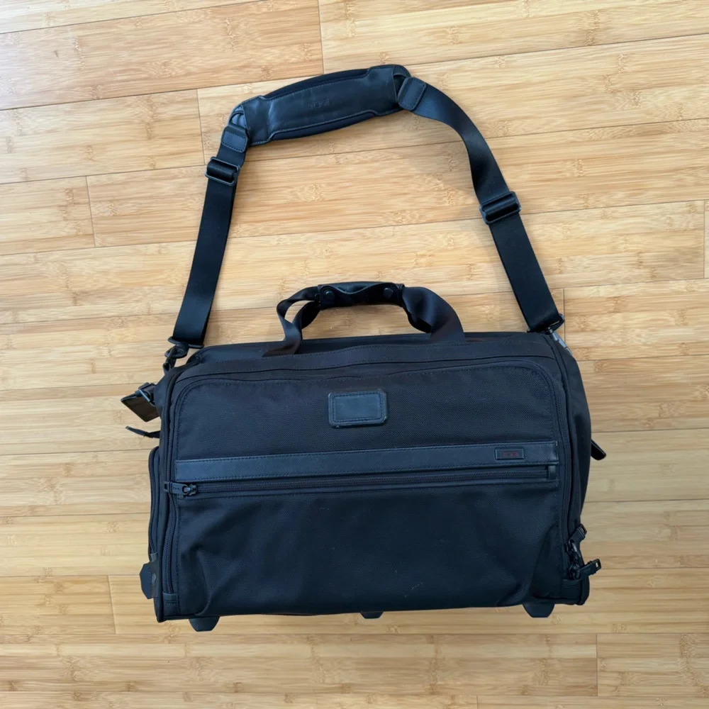 Tumi Black Duffel Bag with Adjustable Shoulder Strap